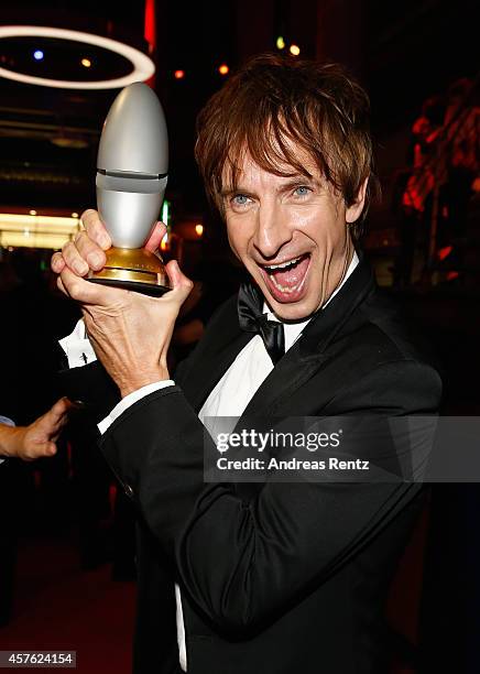 Ingolf Lueck poses with his award during the 18th Annual German Comedy Awards at Coloneum on October 21, 2014 in Cologne, Germany. The show will be...