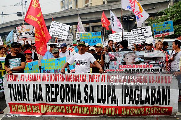 Farmers led by militant peasant group Kilusang Magbubukid ng Pilipinas marched to Mendiola Bridge near the Malacanang Palace in Manila City to demand...