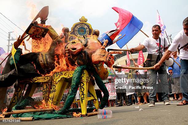 Farmers led by militant peasant group Kilusang Magbubukid ng Pilipinas marched to Mendiola Bridge near the Malacanang Palace in Manila City to demand...