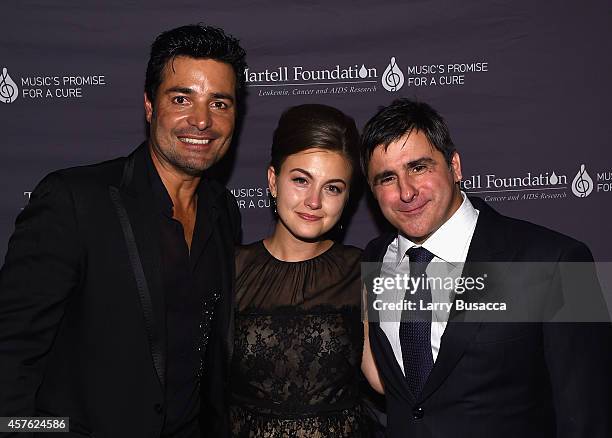 Singer Chayanne, Chairman and CEO, Sony Music Entertainment Latin Iberia Afo Verde, and guest pose backstage at the T.J. Martell Foundation's 39th...