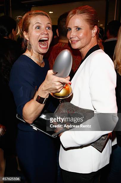 Annette Frier and her sister Sabine Frier attend the 18th Annual German Comedy Awards at Coloneum on October 21, 2014 in Cologne, Germany. The show...
