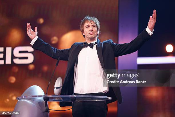 Ingolf Lueck poses with his award during the 18th Annual German Comedy Awards at Coloneum on October 21, 2014 in Cologne, Germany. The show will be...