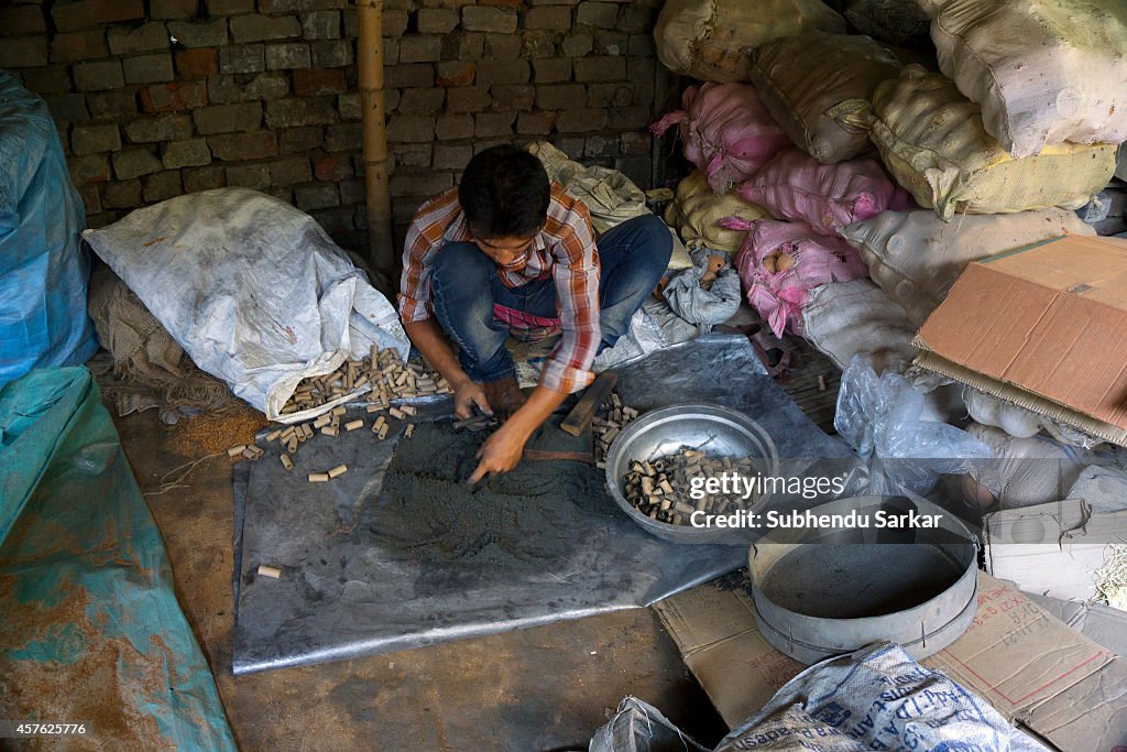 A man works at a firecrackers factory on the outskirts of...