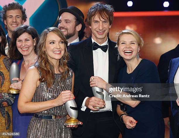 Carolin Kebekus, Ingolf Lueck and Annette Frier pose with their awards during the 18th Annual German Comedy Awards at Coloneum on October 21, 2014 in...