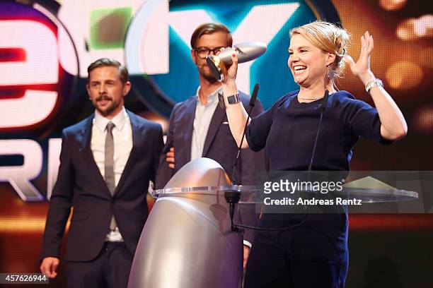 Annette Frier receives her award during the 18th Annual German Comedy Awards at Coloneum on October 21, 2014 in Cologne, Germany. The show will be...