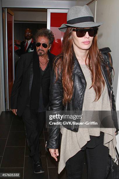 Al Pacino and Lucila Sola seen at LAX on October 21, 2014 in Los Angeles, California.