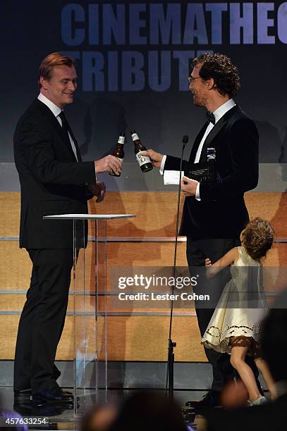 Director/writer Christopher Nolan, honoree Matthew McConaughey, and Vida Alves McConaughey attend the 28th American Cinematheque Award honoring...