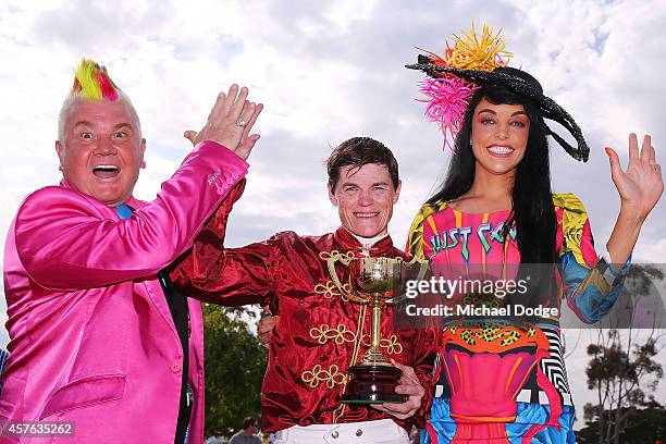 City of Greater Geelong Mayor, Cr Darryn Lyons and his fiancee Elissa Friday pose with Craig Williams after he won on Caravan Rolls On in race 7 the...