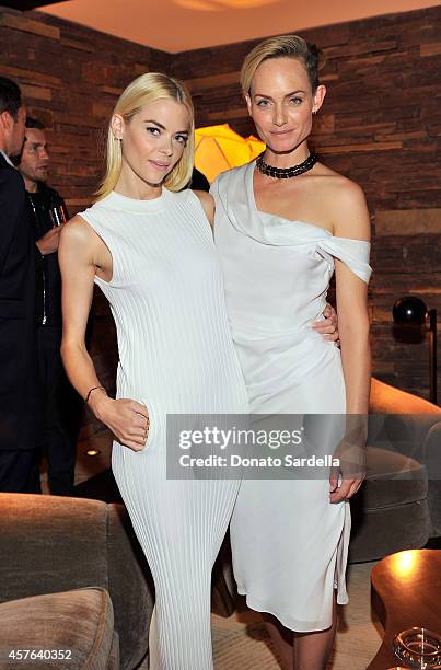 Actresses Jaime King and Amber Valletta attend the CFDA/Vogue Fashion Fund evening dinner on October 21, 2014 in Los Angeles, California.