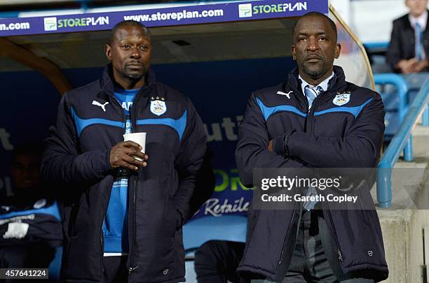 Huddersfield manager Chris Powell with assistant manager Alex Dyer during the Sky Bet Championship match between Huddersfield Town and Brighton &...
