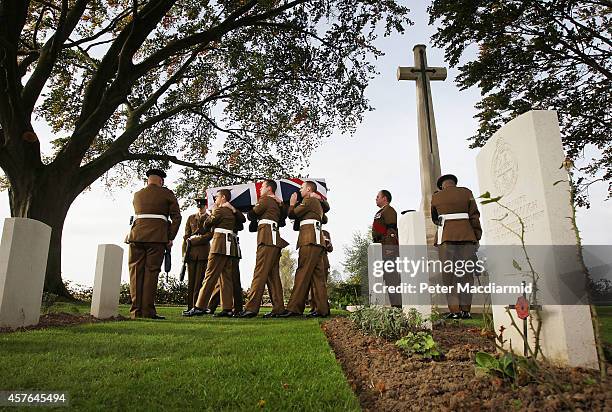 Members of the 4th Battalion The Yorkshire Regiment carry the remains of a World War One soldier during a re-burial ceremony at the Commonwealth War...