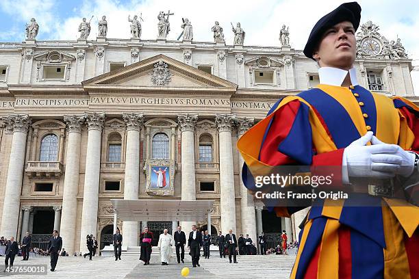 Pope Francis, flanked by the Prefect of the Pontifical House and former personal secretary of Pope Benedict XVI, Georg Ganswein , arrives for his...