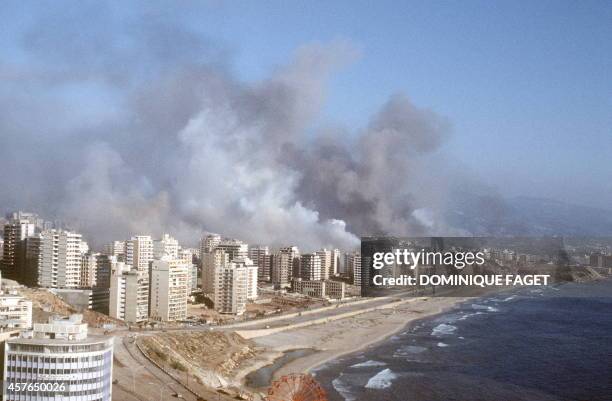 Buildings on the west coast of Beirut burn 04 August 1982 after being shelled by Israeli forces during the "Operation Peace for Galilee". On 06 June...