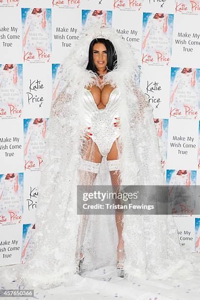 Katie Price attends a photocall to launch her new novel "Make My Wish Come True" at The Worx on October 22, 2014 in London, England.