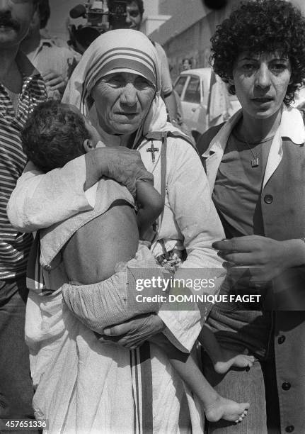 Peace Nobel Prize Mother Teresa hugs a child in West Beirut 14 August 1982. Mother Teresa visited the children who were in the Islamic Home which was...