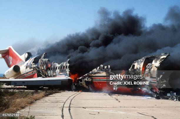 The Royal Jordanian Alia Boeing 727 burns 12 June 1985 on the tarmac of the Beirut airport after it was blown up by six heavy armed Lebanese Chi'ite...