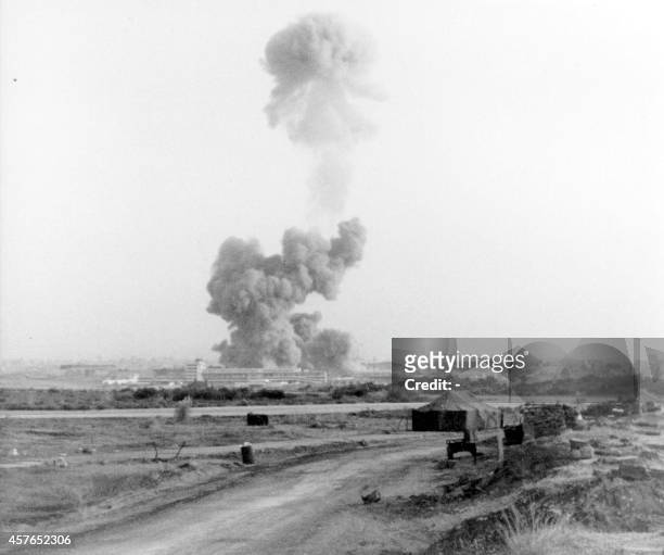 Smoke rises from the US marines headquaters near the Beirut International Airport, after it was destroyed by a suicide bomber driving a truck on 23...