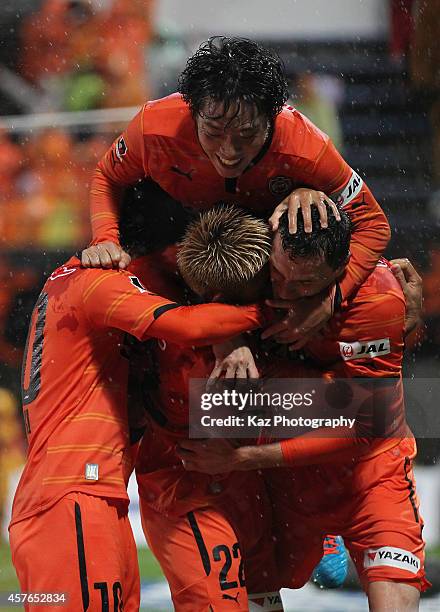 Milivoje Novakovic of Shimizu S-Pulse celebrates scoring his team's second goal with his teammates Kazuya Murata , Genki Omae and Yoshiaki Takagi...