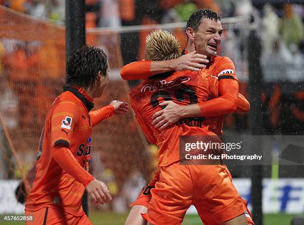 Milivoje Novakovic of Shimizu S-Pulse celebrates scoring his team's second goal with his teammates Kazuya Murata and Genki Omae during the J.League...