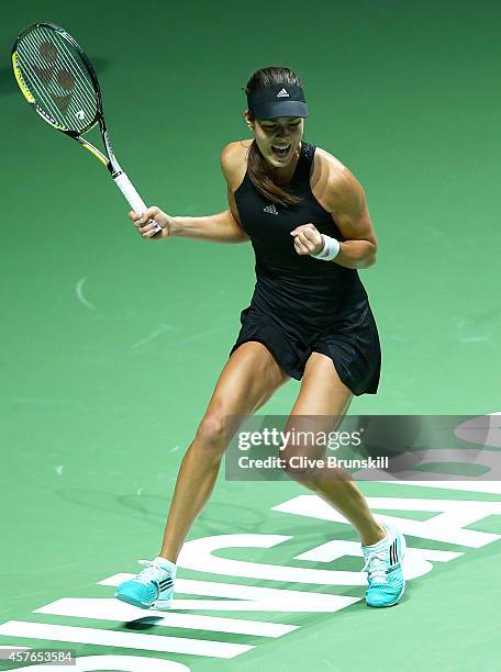 Ana Ivanovic of Serbia celebrates match point and a straight sets victory against Eugenie Bouchard of Canada in their round robin match during the...