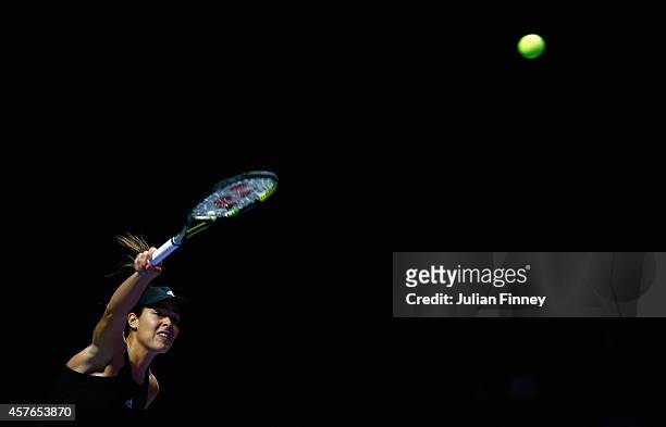 Ana Ivanovic of Serbia serves against Eugenie Bouchard of Canada during day three of the BNP Paribas WTA Finals tennis at the Singapore Sports Hub on...
