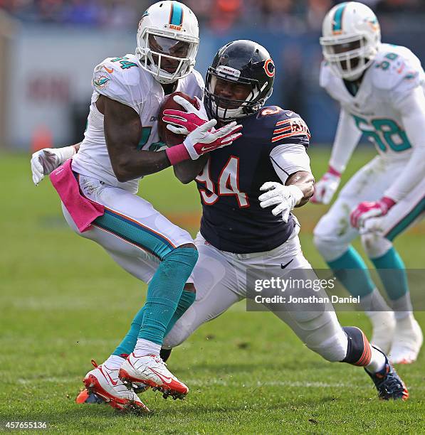 Jarvis Landry of the Miami Dolphins breaks away from Cornelius Washington of the Chicago Bears at Soldier Field on October 19, 2014 in Chicago,...