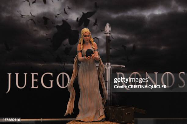 Figurine representing the character Daenerys Targaryen played by Emilia Clarke is displayed for sale at the Osuna museum on October 22, 2014 as film...