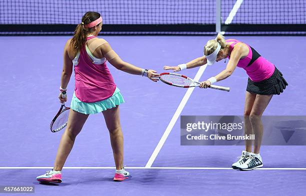 Tracy Austin of the United States and Marion Bartoli of France celebrate a point against Martina Navratilova of the United States and Eva Majoli of...