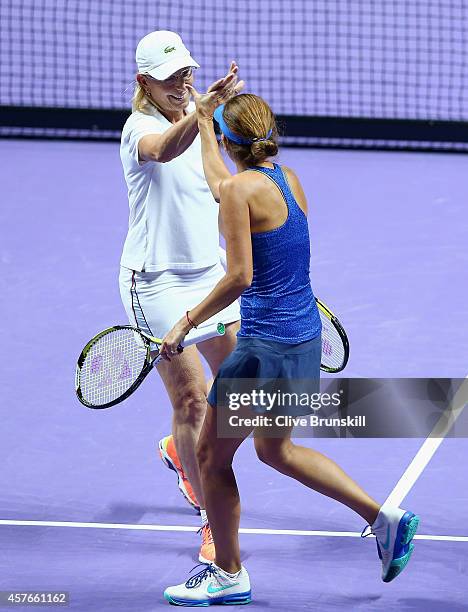 Martina Navratilova of the United States and Eva Majoli of Croatia celebrate a point against Tracy Austin of the United States and Marion Bartoli of...