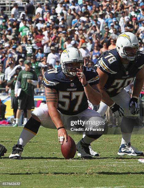 Center Doug Legursky of the San Diego Chargers is set to snap the ball against the New York Jets at Qualcomm Stadium on October 5, 2014 in San Diego,...