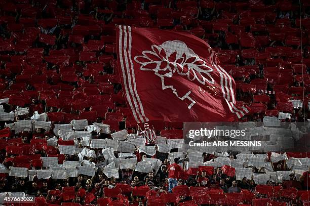 Olympiacos fans cheer prior to the Group A Champions League football match Olympiacos vs Juventus at the Karaiskaki stadium in Athens' Piraeus...