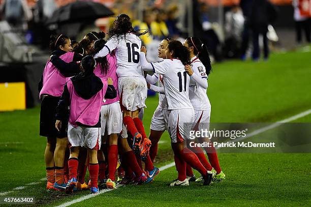 Carolina Venegas of Costa Rica celebrates with her teammates after scoring a goal in the second half of a game against Martinque during the 2014...