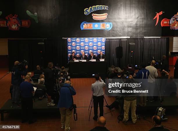 New York Islanders partners Scott Malkin, Charles Wang and Jon Ledecky along with general manager Garth Snow attend a press conference at Nassau...