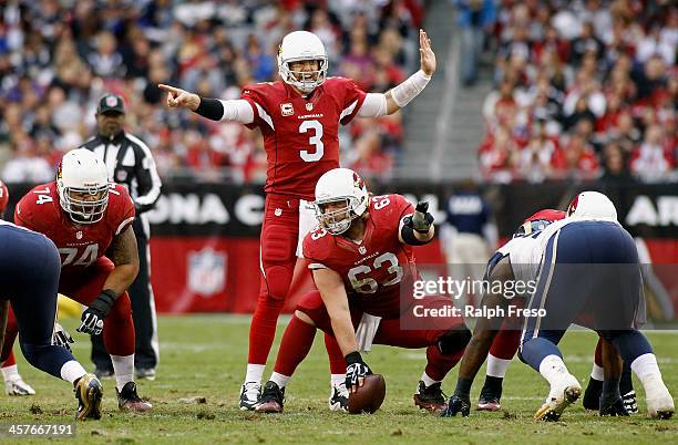 Quarterback Carson Palmer and center Lyle Sendlein of the Arizona Cardinals direct blocking assignments against the St Louis Rams during the third...