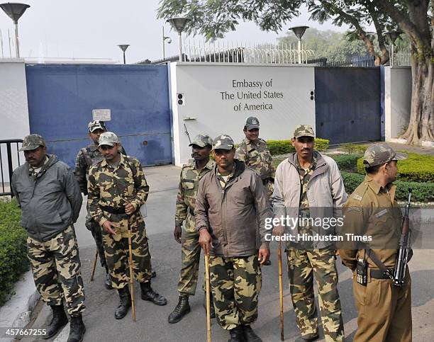 Security personnel stand guard during protest by activists of Naya Daur Party outside the US Embassy against the arrest and ill-treatment of Indian...