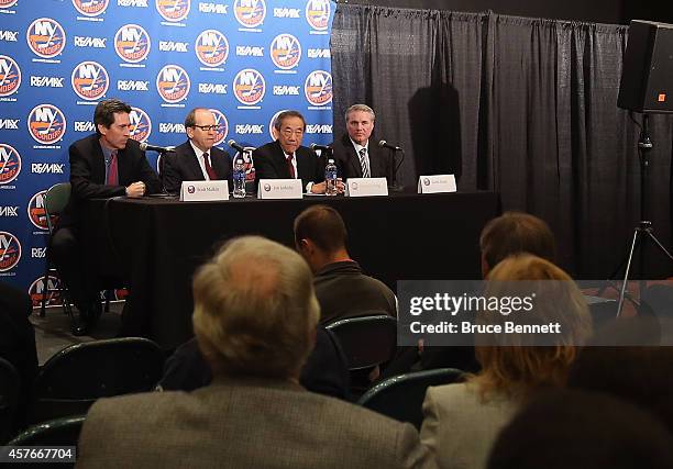 New York Islanders partners Scott Malkin, Charles Wang and Jon Ledecky along with general manager Garth Snow attend a press conference at Nassau...