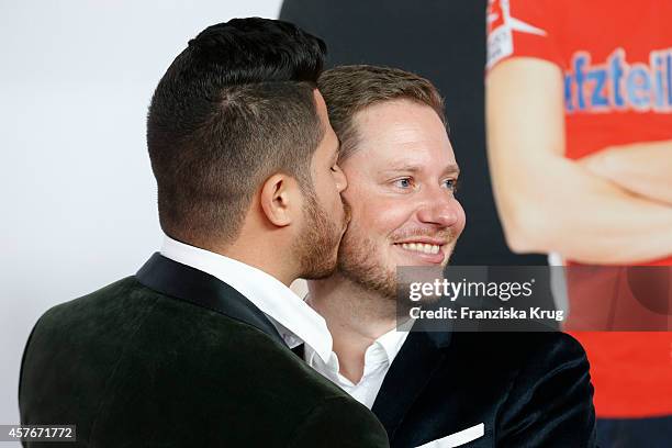 Marco Kreuzpaintner and his husband Gilardo attend the 'Coming In' Premiere in Berlin on October 22, 2014 in Berlin, Germany.