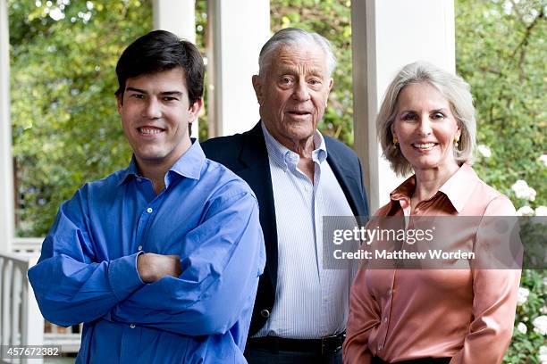 Washington Post editor Ben Bradlee poses with his son Quinn Bradlee and wife Sally Quinn at their home April 2009 in Washington, DC.