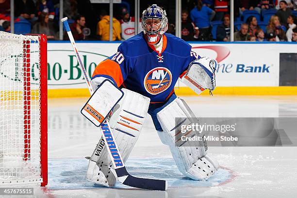 Evgeni Nabokov of the New York Islanders skates against the Montreal Canadiens at Nassau Veterans Memorial Coliseum on December 14, 2013 in...