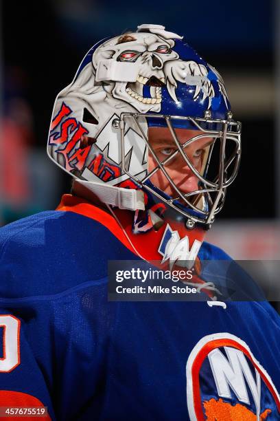 Evgeni Nabokov of the New York Islanders skates against the Montreal Canadiens at Nassau Veterans Memorial Coliseum on December 14, 2013 in...