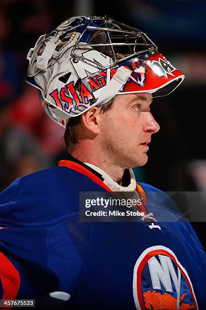 Evgeni Nabokov of the New York Islanders skates against the Montreal Canadiens at Nassau Veterans Memorial Coliseum on December 14, 2013 in...