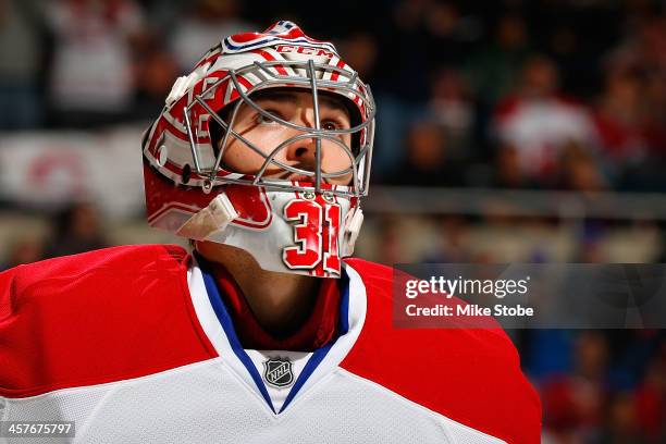 Carey Price of the Montreal Canadiens skates against the New York Islanders at Nassau Veterans Memorial Coliseum on December 14, 2013 in Uniondale,...