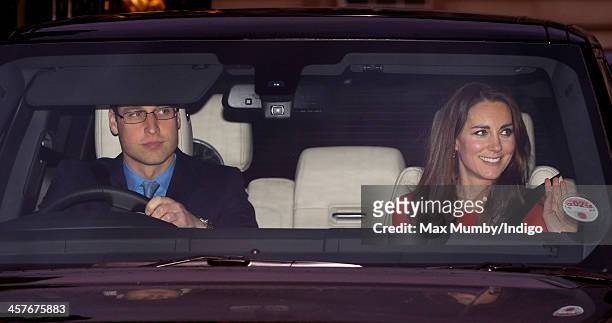 Prince William, Duke of Cambridge and Catherine, Duchess of Cambridge leave Buckingham Palace after attending a Christmas Lunch hosted by Queen...