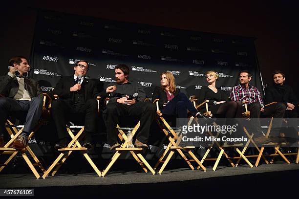 Scott Foundas, film director David O. Russell, actors Christian Bale, Amy Adams, Jennifer Lawrence, Bradley Cooper, and Jeremy Renner speak on a...