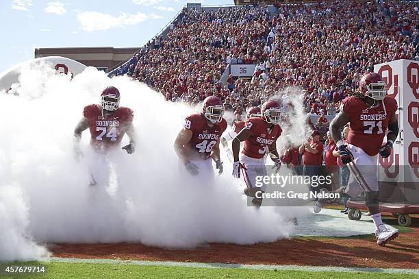 Oklahoma Adam Shead , Aaron Ripkowski , Sterling Shepard and Tyrus Thompson taking field before game vs Kansas State at Gaylord Family-Oklahoma...