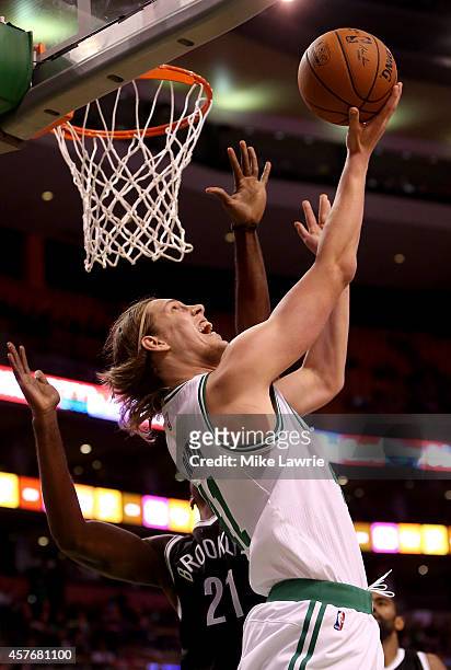 Kelly Olynyk of the Boston Celtics drives to the basket against Cory Jefferson of the Brooklyn Nets during a preseason game at TD Garden on October...