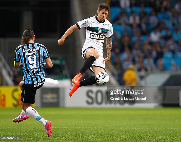 Hernan Barcos of Gremio battles for the ball against Everaldo of Figueirense during the match Gremio v Figueirense as part of Brasileirao Series A...