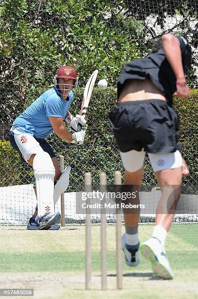 Matthew Hayden bats during the ICC Cricket World Cup net bowler program launch at Allan Border Field on October 23, 2014 in Brisbane, Australia.