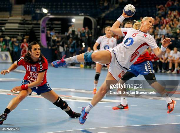 Heidi Loke of Norway scores a goal past Sanja Damnjanovic of Serbia during the 2013 World Women's Handball Championship 2013 match between Serbia and...
