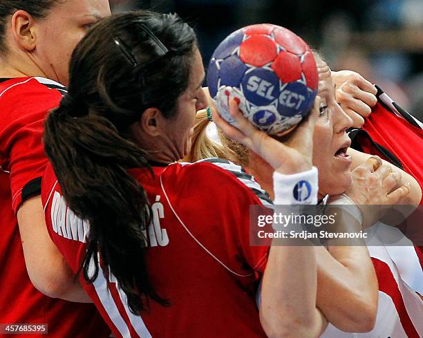 Heidi Loke of Norway in action against Sanja Damnjanovic of Serbia during the 2013 World Women's Handball Championship 2013 match between Serbia and...